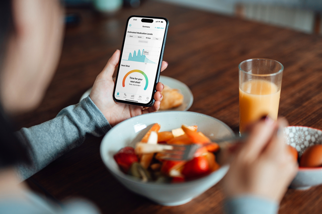 Person reviewing health metrics on a phone