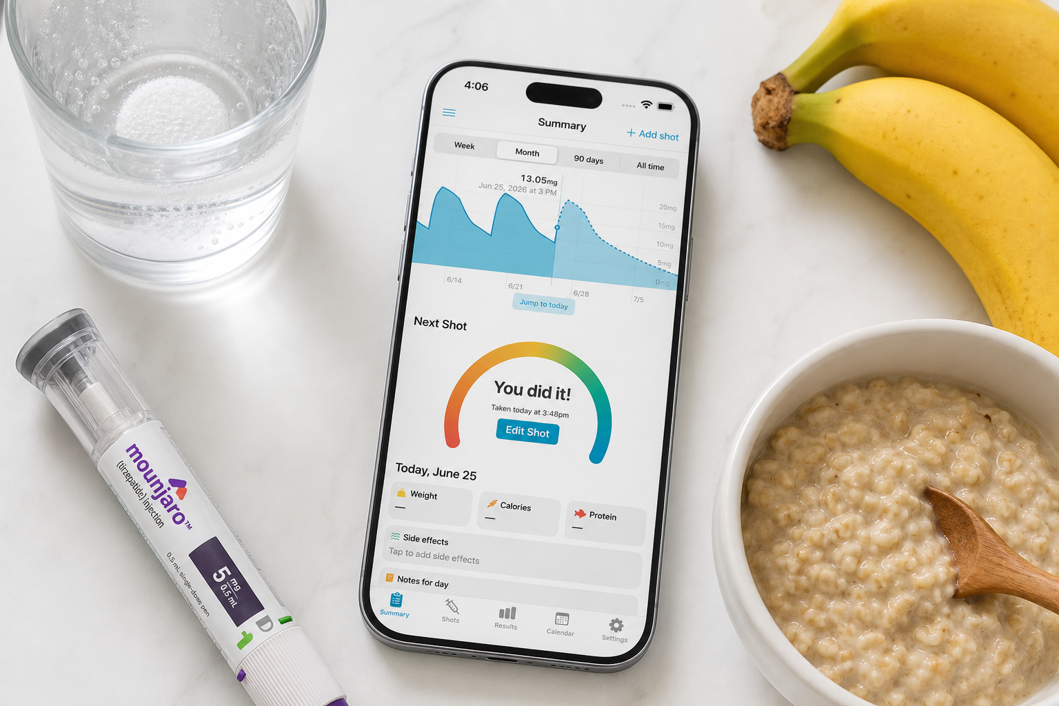 Shotsy app on a phone beside a GLP-1 injection pen, glass of water, bananas, and a bowl of oatmeal on a white countertop